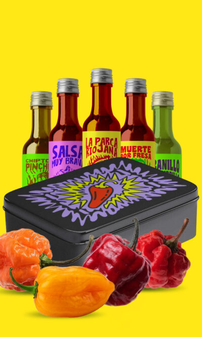Limited edition hot sauce tasting pack in a premium metal tin showing five chilli sauces ranging from mild to extra hot, perfect for spice lovers
